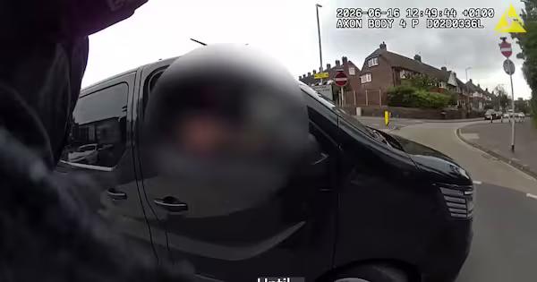 Watch: Armed UK officer jumps in stranger's van to catch fleeing man