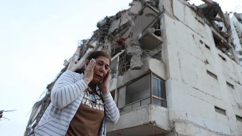 Neighbours dig through rubble in search of loved ones